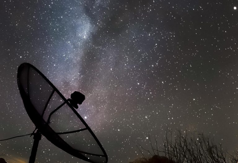 Satellite with Milky Way galaxy background